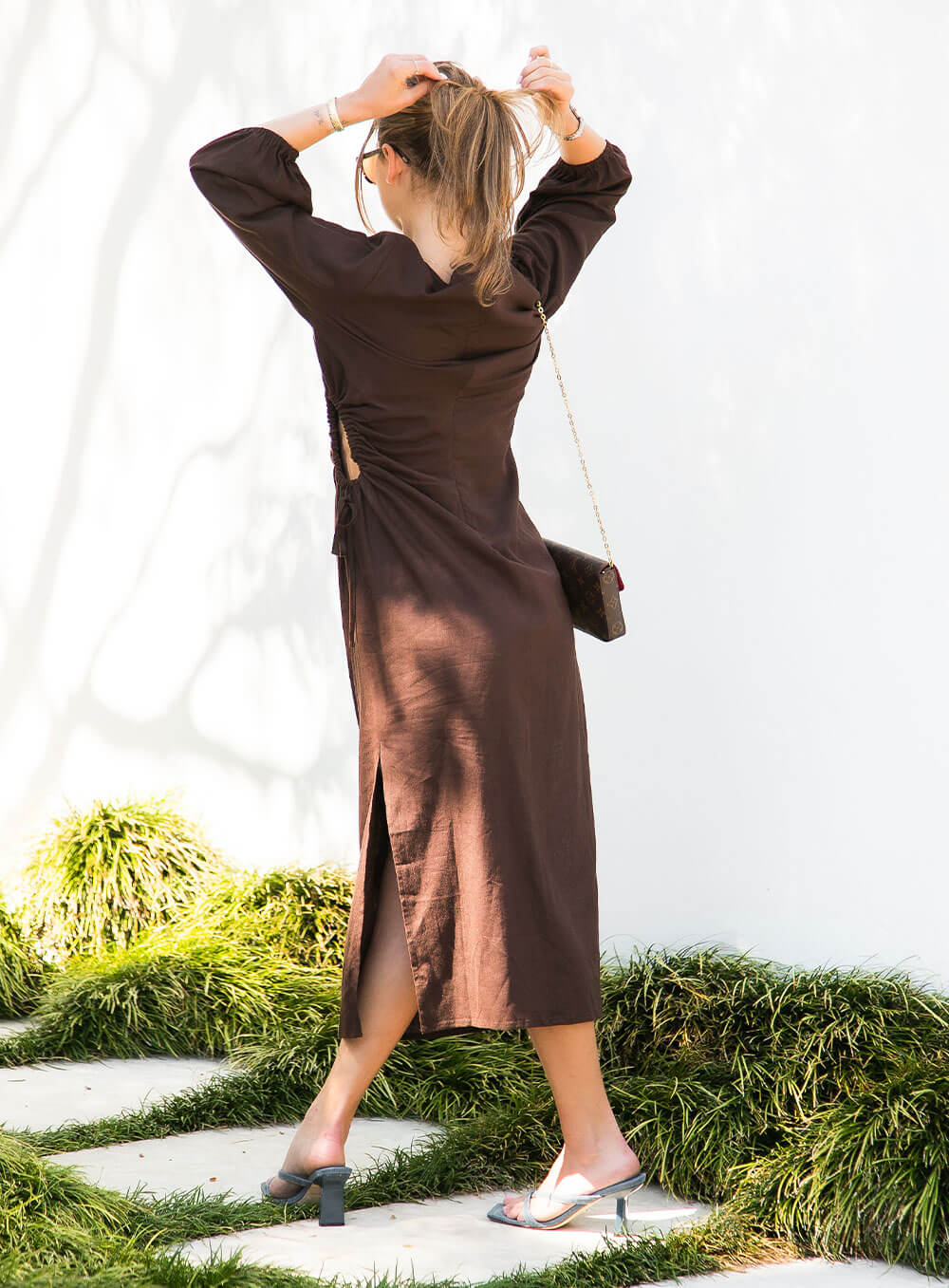 The Emma Linen Dress in chocolate has an asymmetric cut out with drawstring, split in side seam, ruched neck detail, invisible zip in back seam.