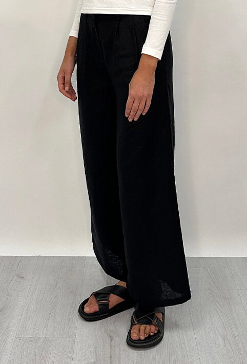 Edith Linen Culottes in black is 100% Linen with elastic waistband at back, only slightly cropped, button and zip enclosure at front and 2 side pockets