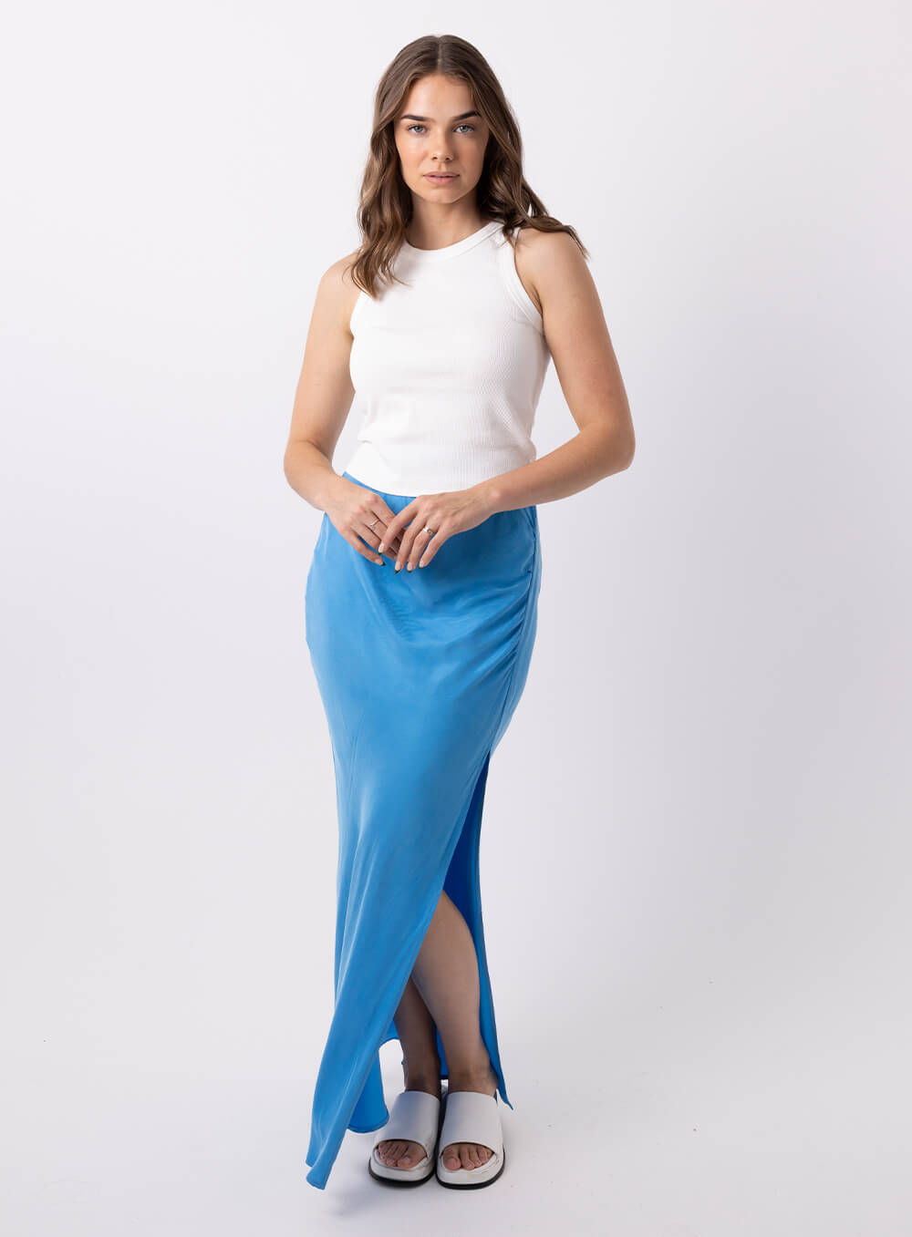 The Allira Cupro skirt is made from a soft feel cupro fabric and features a side split, side rouched panel to create a draping effect through the hip and is a full length skirt