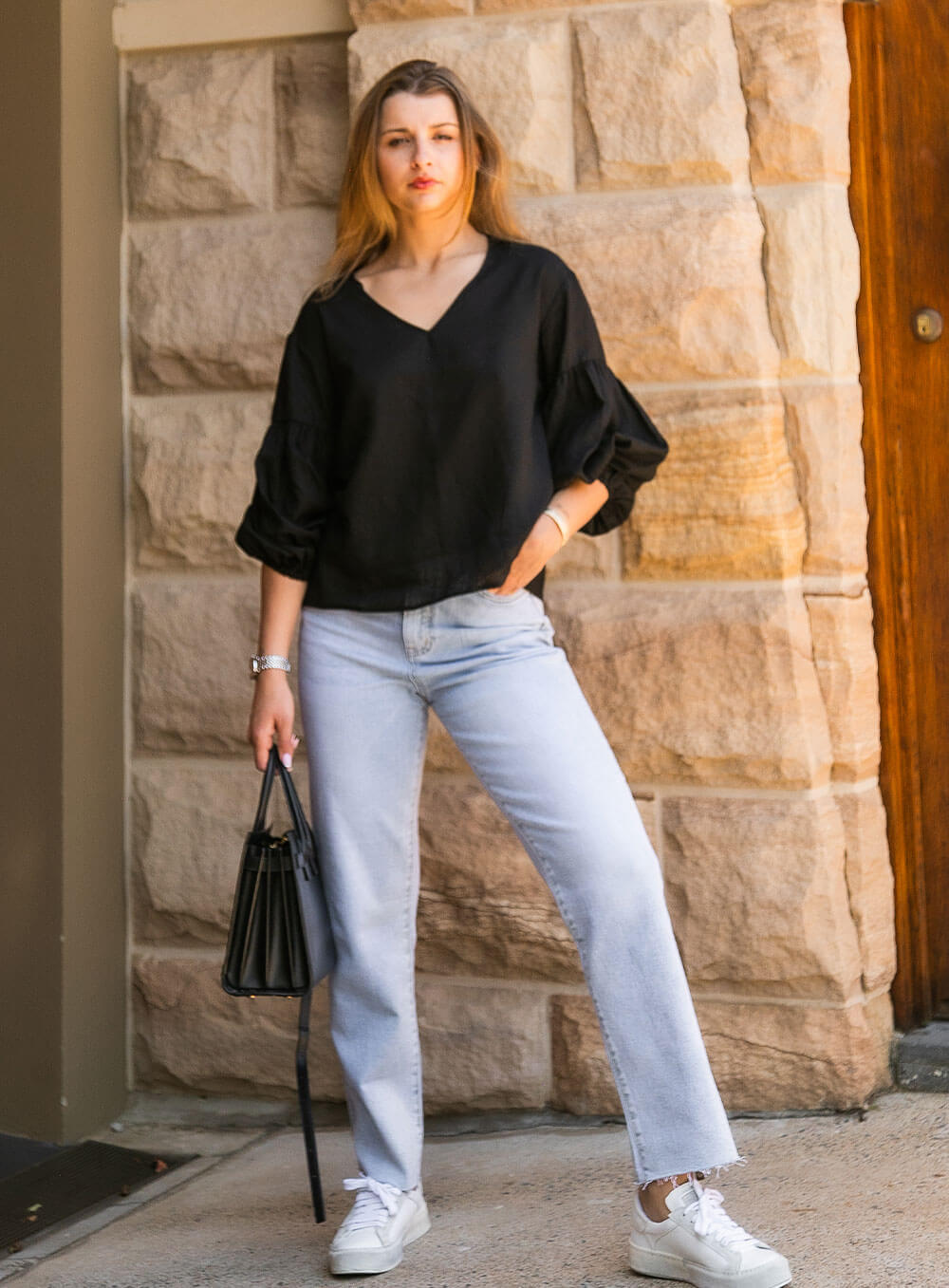 The Celeste Top in black has an elasticised cuff, ruched sleeve detail, v neck with collar detail and breathable with soft washed linen