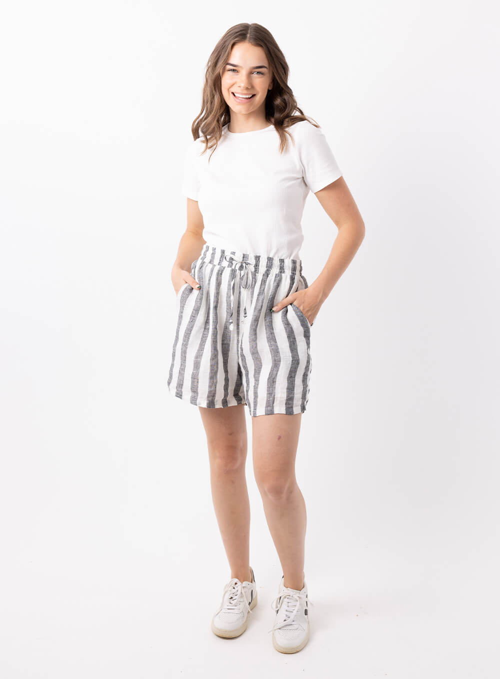 The Charlie stripe linen short in black and white is made from 100% breathable linen, featuring wide elastic waistband with tie, finishes mid thigh with finished hem