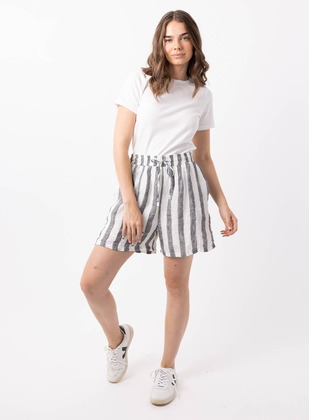 The Charlie stripe linen short in black and white is made from 100% breathable linen, featuring wide elastic waistband with tie, finishes mid thigh with finished hem