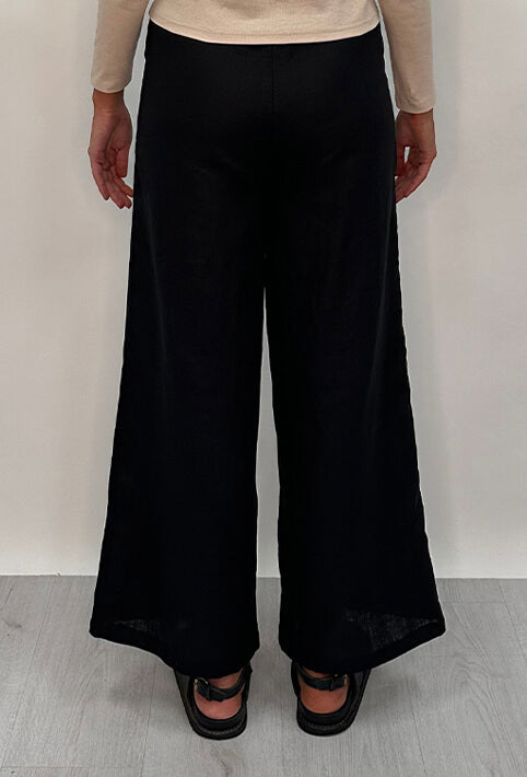 Edith Linen Culottes in black is 100% Linen with elastic waistband at back, only slightly cropped,  button and zip enclosure at front and 2 side pockets