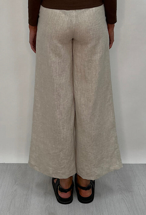 Edith Linen Culottes in beige is 100% Linen with elastic waistband at back, only slightly cropped,  button and zip enclosure at front and 2 side pockets