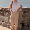 Athena Linen Cargo Pant in beige is 100% Linen, elastic waistband at back, belt loops, slightly tapered towards the hem, 2 Pockets at back, 2 Pockets on side leg