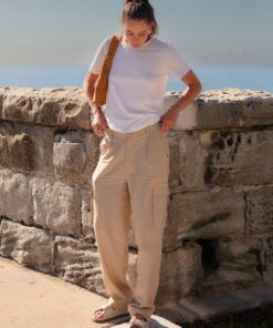 Athena Linen Cargo Pant in beige is 100% Linen, elastic waistband at back, belt loops, slightly tapered towards the hem, 2 Pockets at back, 2 Pockets on side leg