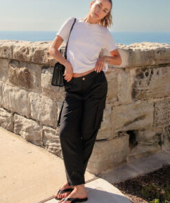 Athena Linen Cargo Pant in black is 100% Linen, elastic waistband at back, belt loops, slightly tapered towards the hem, 2 Pockets at back, 2 Pockets on side leg