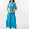 Bella Dress in Aqua features a gathered neckline, sleeveless, small cut outs at top and side of hips, with a a small ring above belly button and midi in length with a flowing skirt.