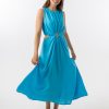 Bella Dress in Aqua features a gathered neckline, sleeveless, small cut outs at top and side of hips, with a a small ring above belly button and midi in length with a flowing skirt.