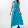 Bella Dress in Aqua features a gathered neckline, sleeveless, small cut outs at top and side of hips, with a a small ring above belly button and midi in length with a flowing skirt.