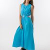 Bella Dress in Aqua features a gathered neckline, sleeveless, small cut outs at top and side of hips, with a a small ring above belly button and midi in length with a flowing skirt.