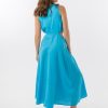 Bella Dress in Aqua features a gathered neckline, sleeveless, small cut outs at top and side of hips, with a a small ring above belly button and midi in length with a flowing skirt.
