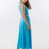 Bella Dress in Aqua features a gathered neckline, sleeveless, small cut outs at top and side of hips, with a a small ring above belly button and midi in length with a flowing skirt.