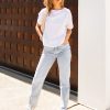 The Celeste Organic Cotton white t-shirt is designed to be loose fit through teh body, slightly cropped in length, loose crew neck line with self fabric neck trim.