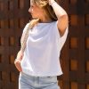 The Celeste Organic Cotton white t-shirt is designed to be loose fit through teh body, slightly cropped in length, loose crew neck line with self fabric neck trim.