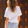 The Celeste Organic Cotton white t-shirt is designed to be loose fit through teh body, slightly cropped in length, loose crew neck line with self fabric neck trim.