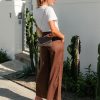 Edith Linen Culottes in chocolate is 100% Linen with elastic waistband at back, only slightly cropped,  button and zip enclosure at front and 2 side pockets