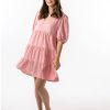 The Eleanor mini dress in blush pink features a flowing layered a line shape with draping linen/viscose fabric, puff 3/4 sleeves with elastic cuff which can be pushed up to the elbow, a dropped v shape neckline with a square finish.