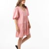 The Eleanor mini dress in blush pink features a flowing layered a line shape with draping linen/viscose fabric, puff 3/4 sleeves with elastic cuff which can be pushed up to the elbow, a dropped v shape neckline with a square finish.
