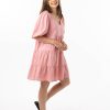 The Eleanor mini dress in blush pink features a flowing layered a line shape with draping linen/viscose fabric, puff 3/4 sleeves with elastic cuff which can be pushed up to the elbow, a dropped v shape neckline with a square finish.