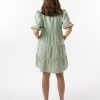 The Eleanor mini dress in sage features a flowing layered a line shape with draping linen/viscose fabric, puff 3/4 sleeves with elastic cuff which can be pushed up to the elbow, a dropped v shape neckline with a square finish.