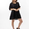 The Eleanor mini dress in black features a flowing layered a line shape with draping linen/viscose fabric, puff 3/4 sleeves with elastic cuff which can be pushed up to the elbow, a dropped v shape neckline with a square finish.