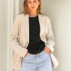 The Harper Linen Blazer has shoulder pads, is fully lined with tortoiseshell buttons and functional button closures. A tailored cut pocket with flap detailing.