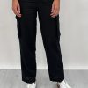 Athena Linen Cargo Pant in black is 100% Linen, elastic waistband at back, belt loops, slightly tapered towards the hem, 2 Pockets at back, 2 Pockets on side leg