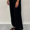 Edith Linen Culottes in black is 100% Linen with elastic waistband at back, only slightly cropped,  button and zip enclosure at front and 2 side pockets