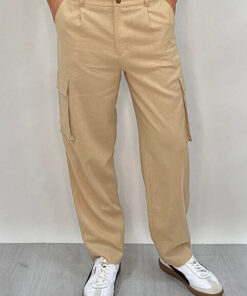 Athena Linen Cargo Pant in beige is 100% Linen, elastic waistband at back, belt loops, slightly tapered towards the hem, 2 Pockets at back, 2 Pockets on side leg