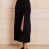 The Lily Skirt in black features a ruched split detailing that adds both shape and texture, functional ruching with tie leg splits and invisible zip back seam.