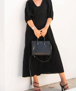 The Olive Dress in black is mid length, lined, features elasticated sleeve, tiered style front bodice detailing.