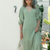 The Olive Dress in Sage is mid length, lined, features elasticated sleeve, tiered style front bodice detailing.