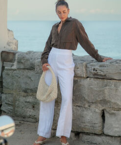 The Sienna Cupro shirt in chocolate is a long sleeve soft velvet feeling long sleeve shirt with 2 chest pockets, scoop hem and self fabric buttons down the front.