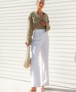 The Sienna Cupro shirt in latte is a long sleeve soft velvet feeling long sleeve shirt with 2 chest pockets, scoop hem and self fabric buttons down the front.